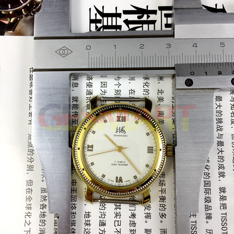 38mm Shanghai Factory manual mechanical watch with golden shock-resistant case and classic design.