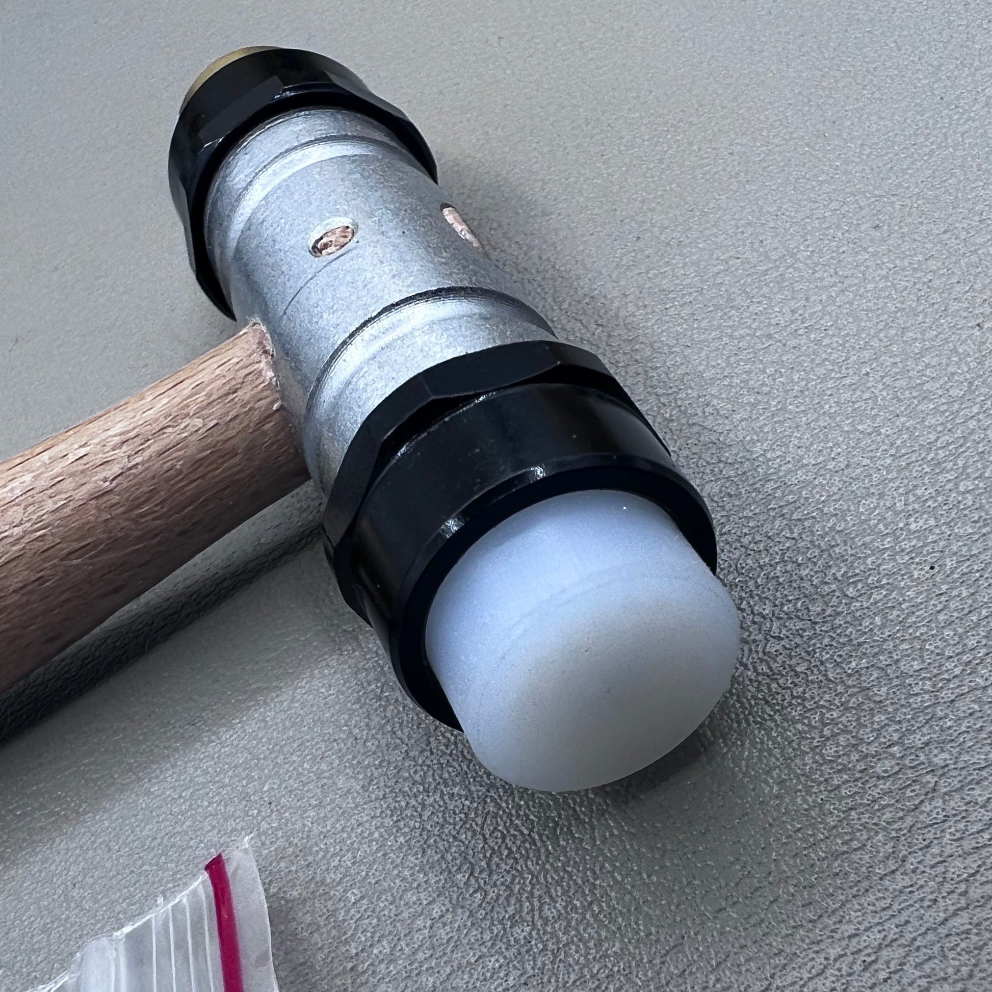 Swiss Tool Bergeon 30417 hammer with replaceable brass and synthetic ends for delicate watch repair tasks.