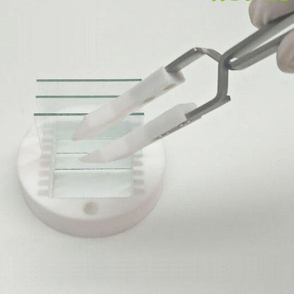 Wide headed PTFE tweezers, acid and alkali resistant, reverse self-locking for secure handling.