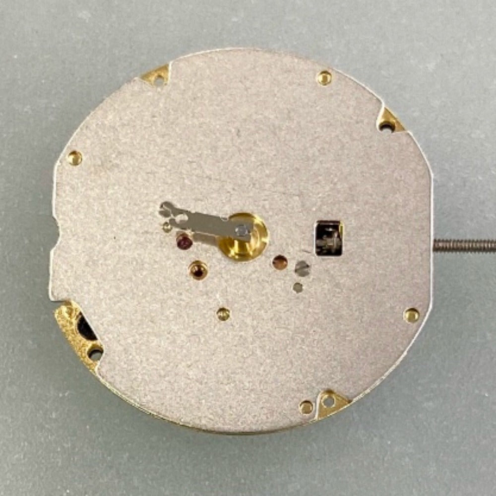 Swiss Made Ronda 702 quartz movement watch part with two golden gilted hands for precision timekeeping.