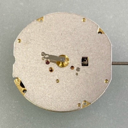 Swiss Made Ronda 702 quartz movement watch part with two golden gilted hands for precision timekeeping.