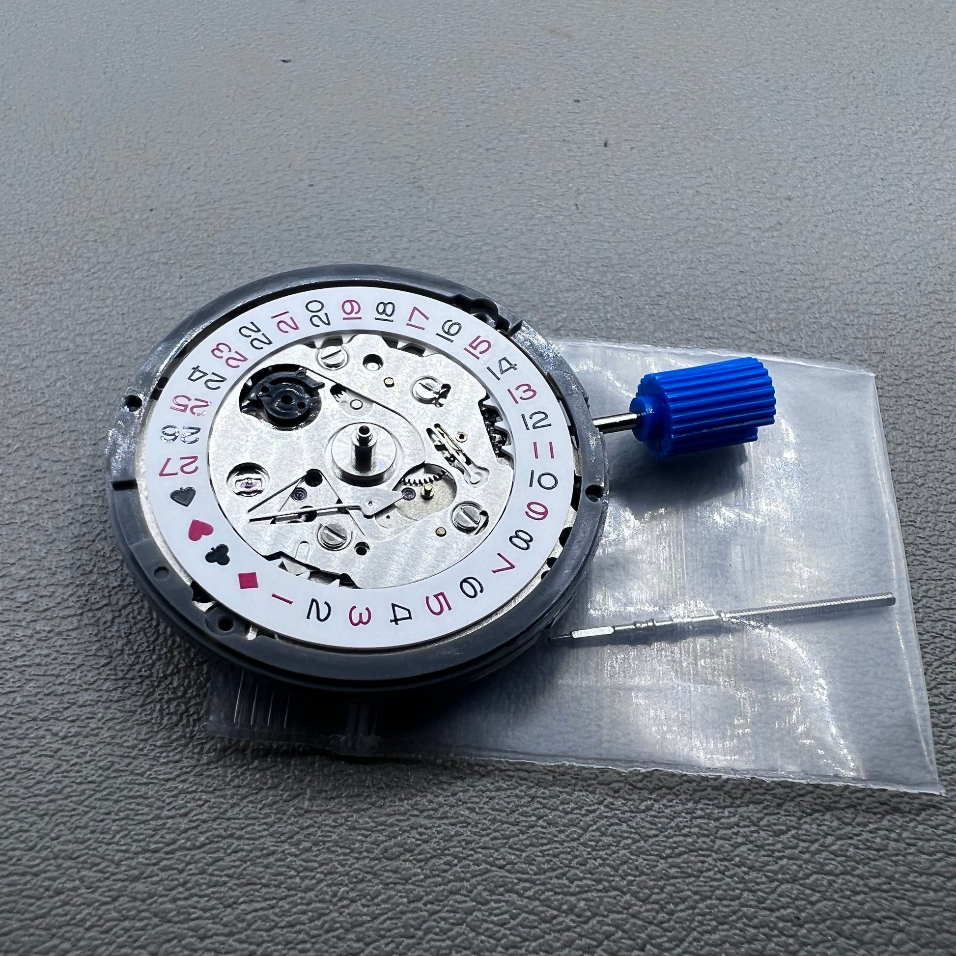 Seiko NH35A automatic mechanical movement with black spade hand, crown at 3 o'clock for SKX007.