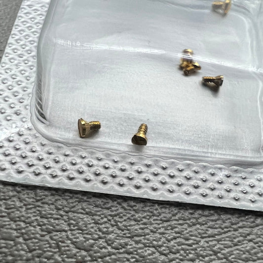 Set of 6 L4.209.4 watch case back screws, 1.2�0.7�1.7mm, for precise watch repair and maintenance.