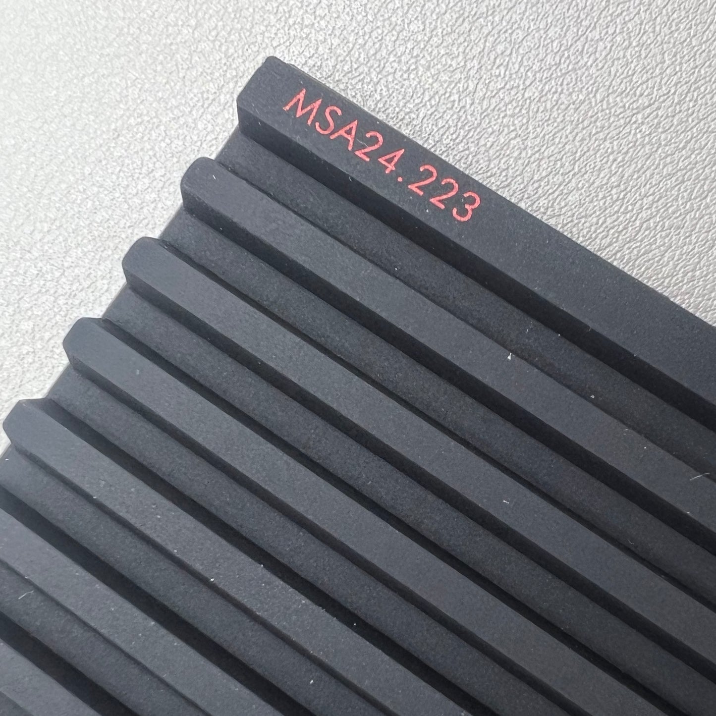 Swiss Horotec black silicon anti-slip bench mat with 32 grooves, ideal for watch repair tools organization.
