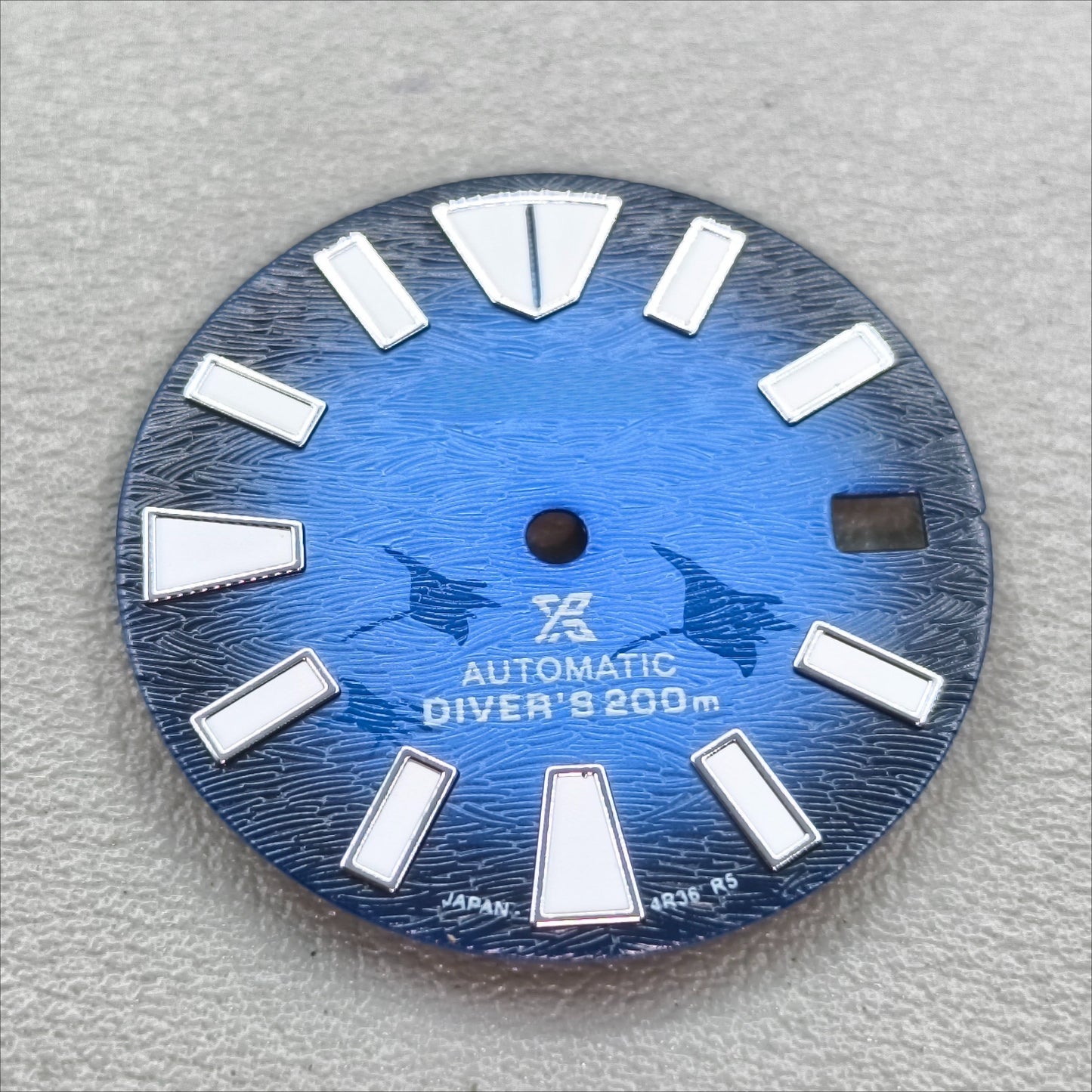 watch dial with S logo