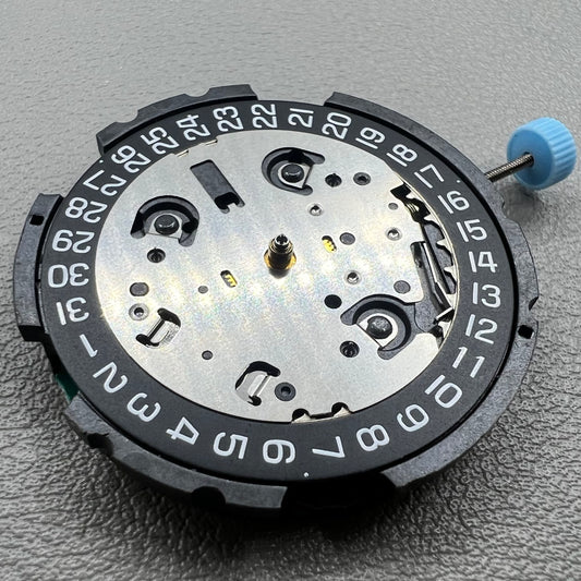 Swiss ETA G10.212 quartz watch movement with date at 4, large hands, small seconds, and black disk by ETA.