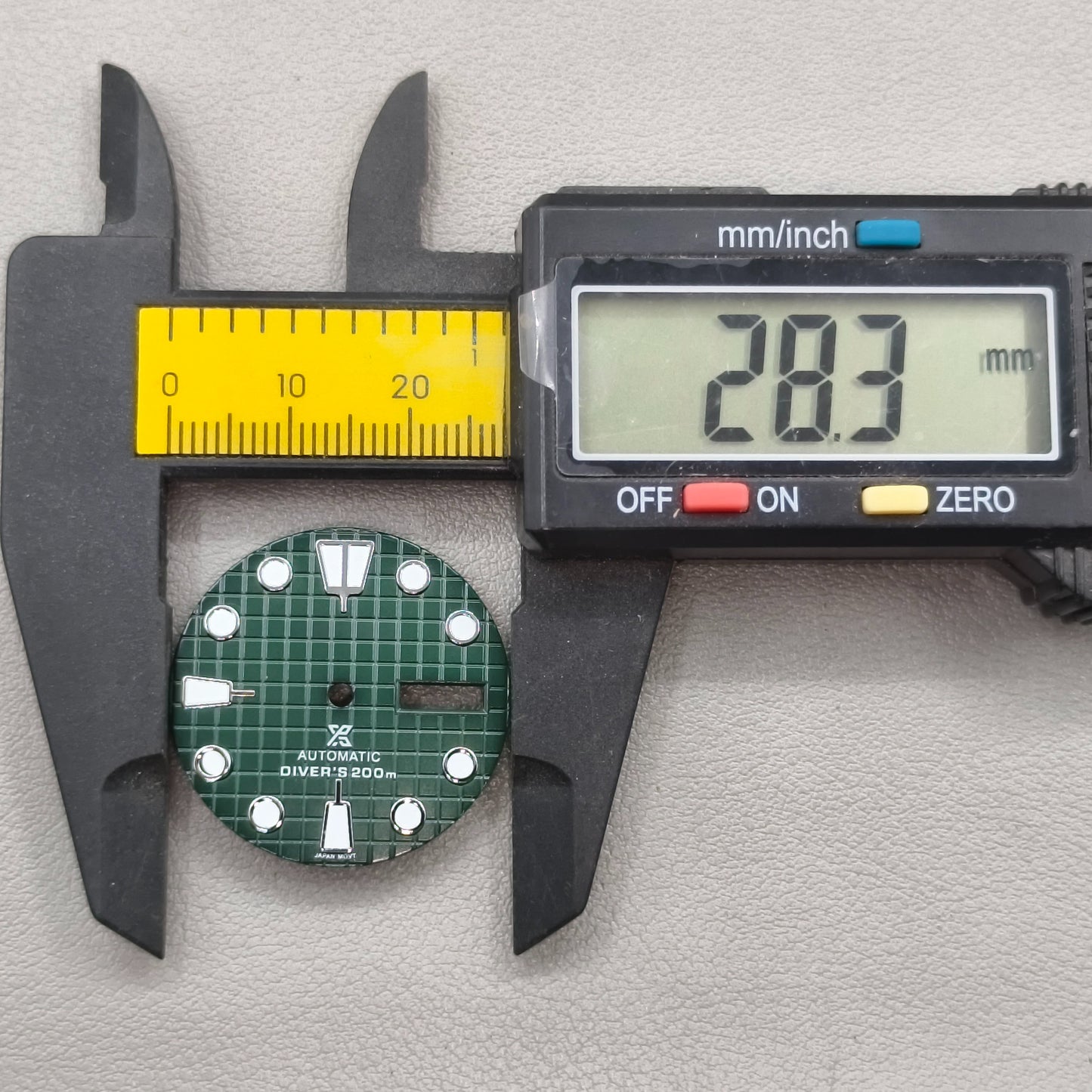 watch dial with S logo