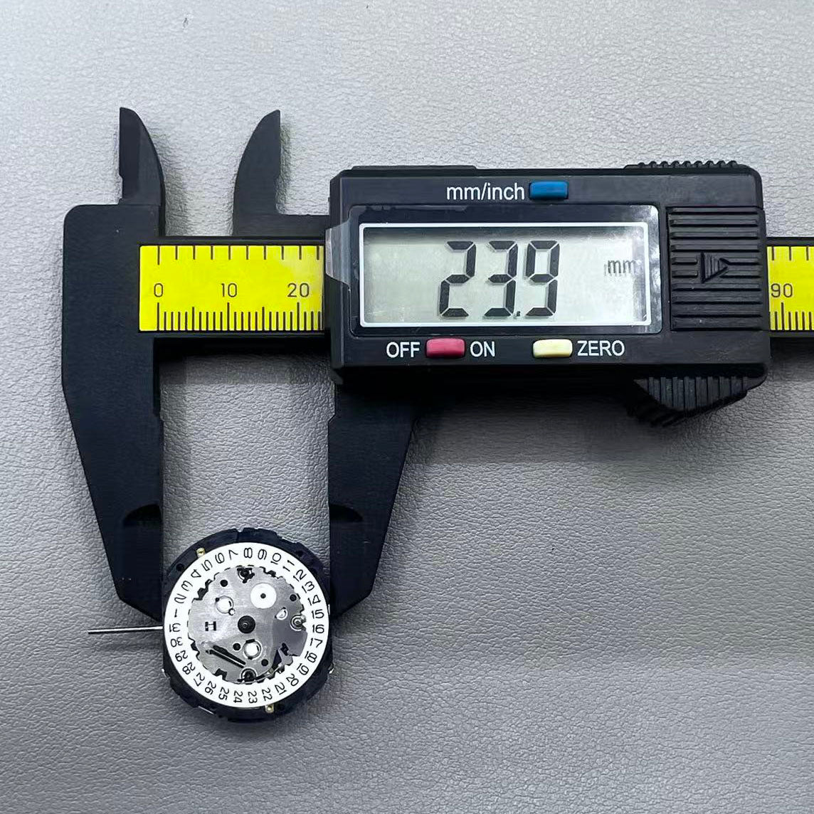 Japan YM57.A watch accessory featuring quartz multifunction movement with small second subdials at 6, 9, and 12 o'clock.