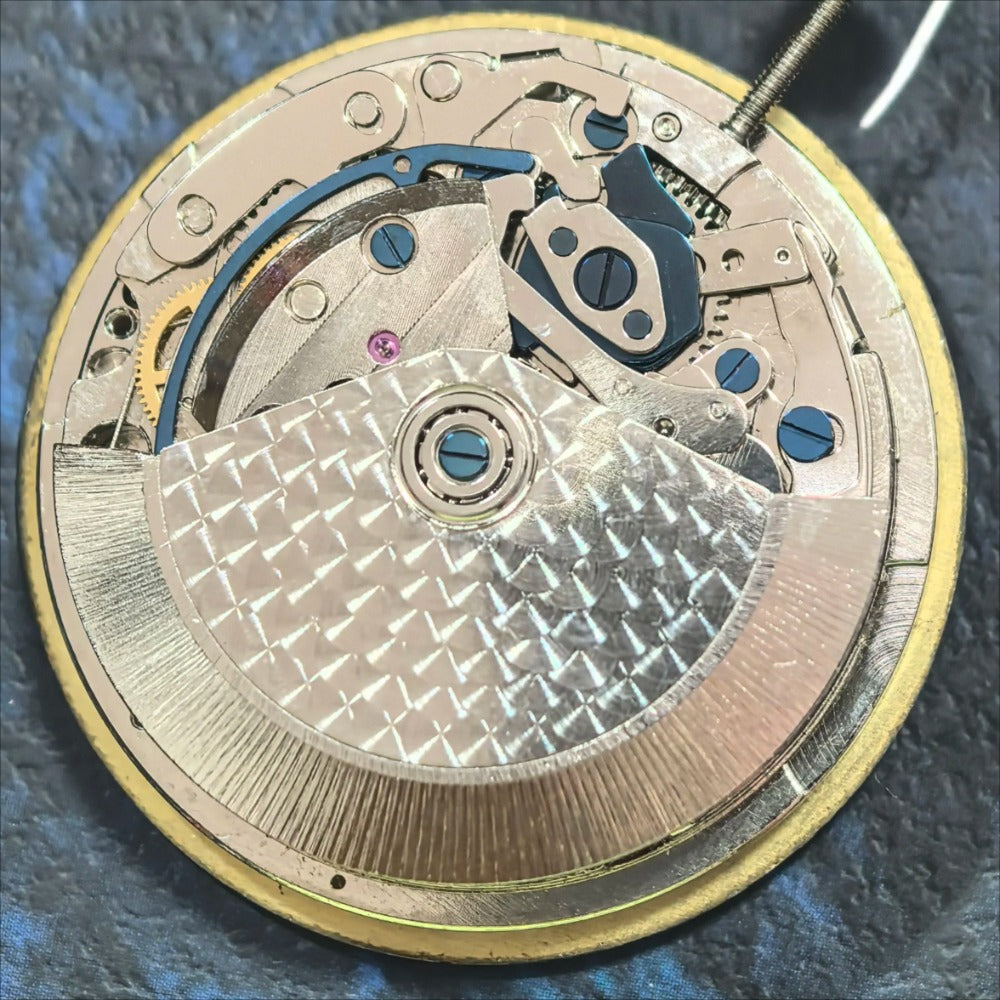 Dandong 7750 mechanical movement with small seconds at 3 and 9, precision watch repair part by China Made.
