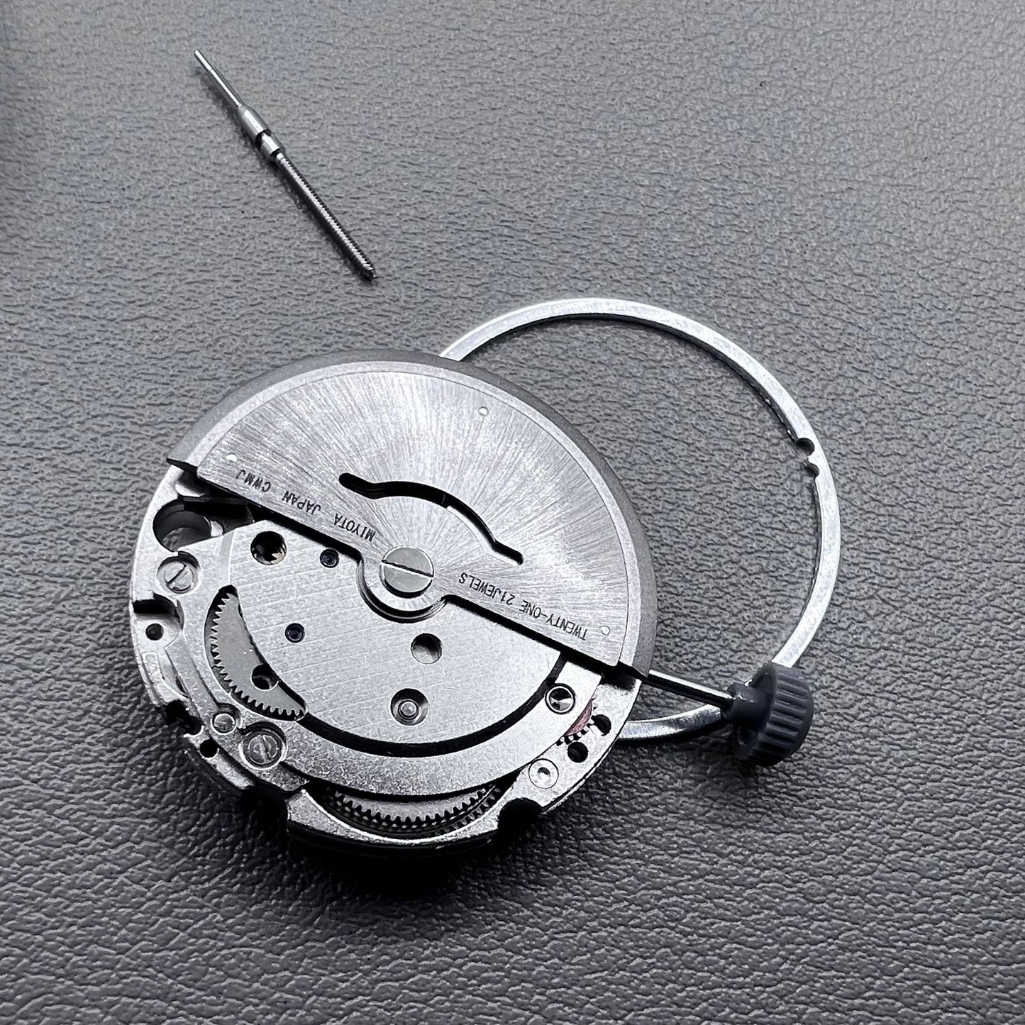 Japan Miyota 8215 silver plated automatic watch movement with date at 6 o?clock, precise mechanical design.