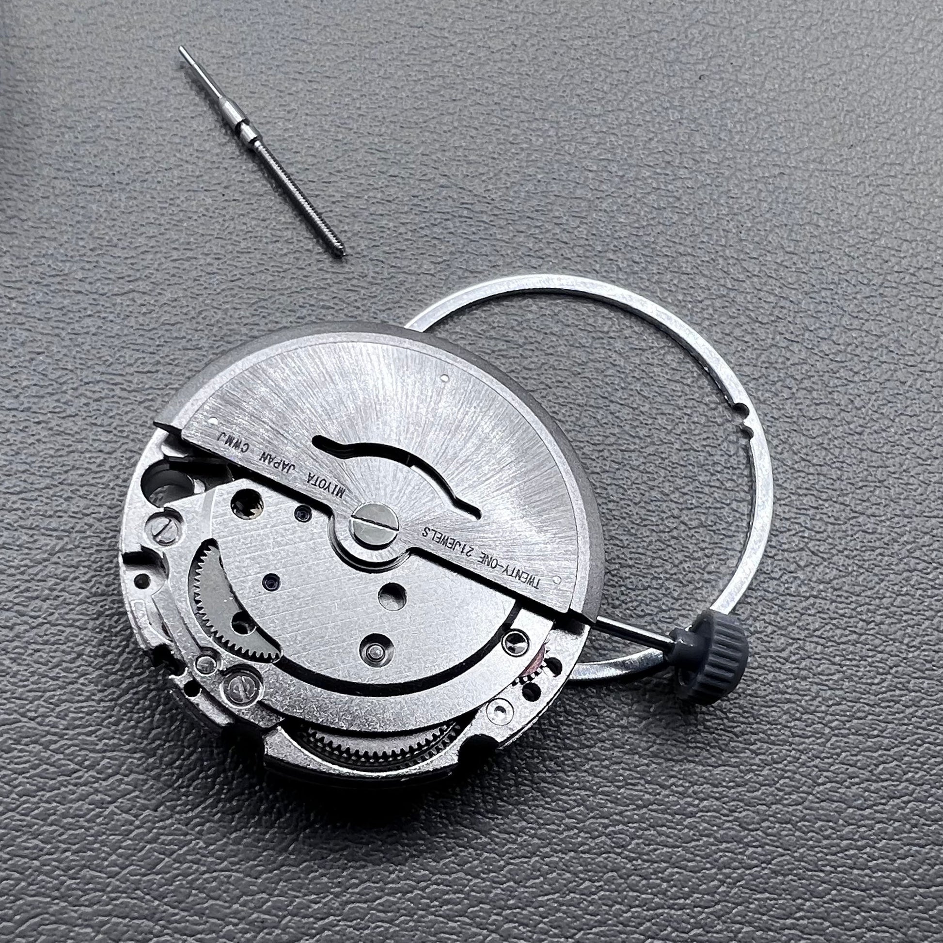 Japan Miyota 8215 silver plated automatic watch movement with date at 6 o?clock, precise mechanical design.