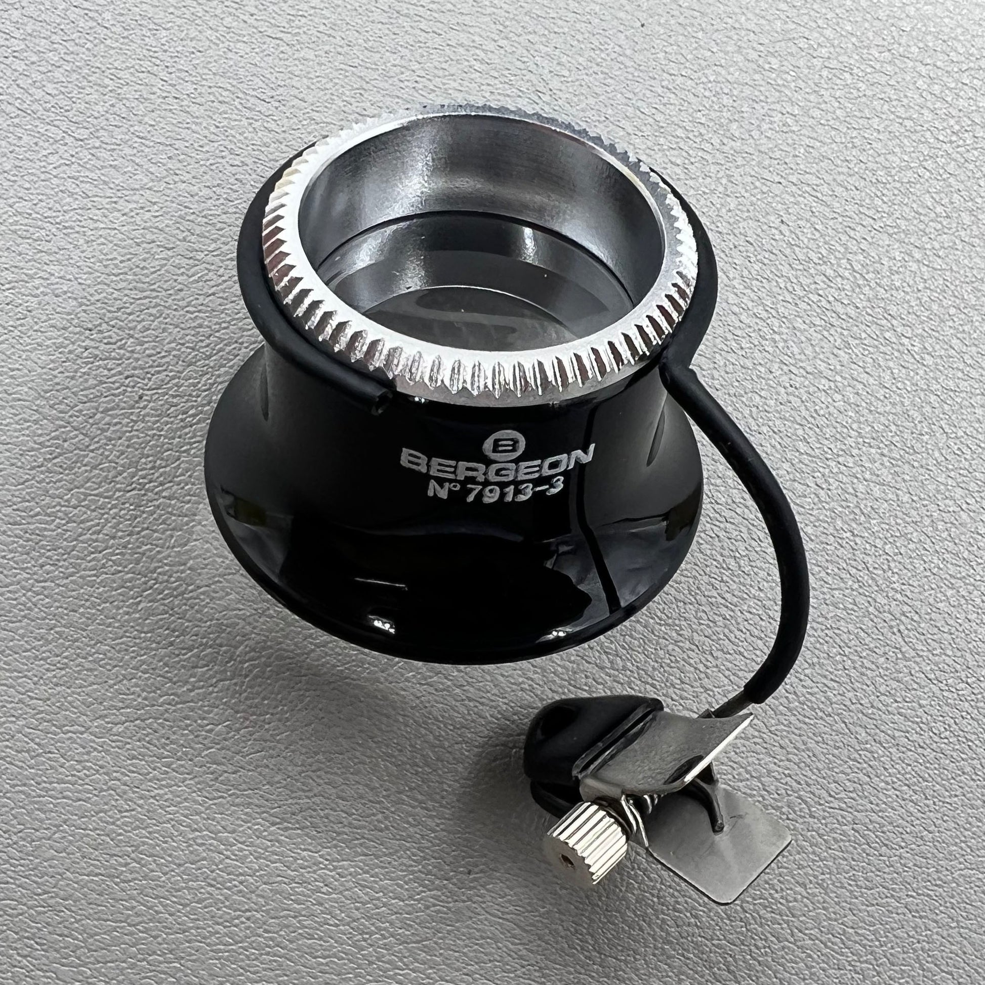 Swiss Bergeon 7913 3.3x magnifying eyeglass clip for precise watch accessory repairs and adjustments.