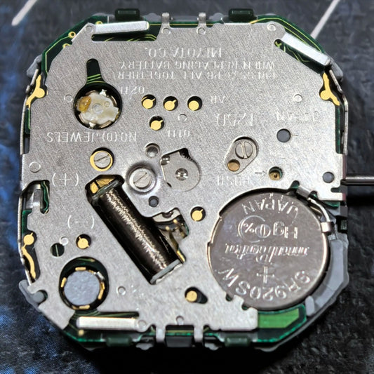 Japan Made Miyota T250 quartz watch part showing 3 hands and display screen for precise timekeeping.