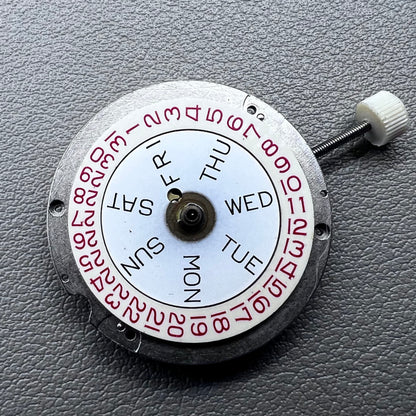 Disassembled Swiss RONDA MATIC 1217-21 manual winding watch movement showcasing intricate components.