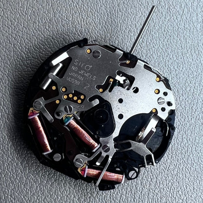 Original Japan VD59 watch movement close-up showing multifunctional quartz small second at 6/9/12 o'clock positions.