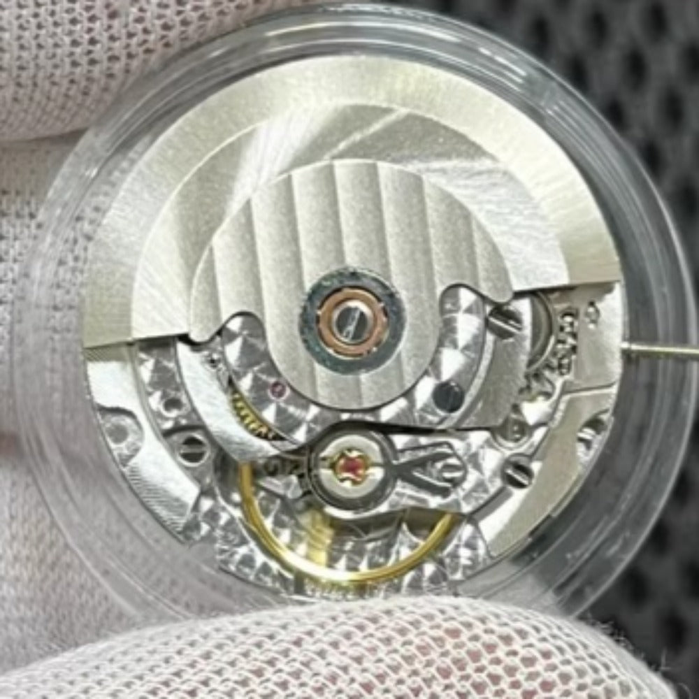 Close-up of Asian 7750 automatic chronograph movement with day date display at 3 o'clock for precise timekeeping.
