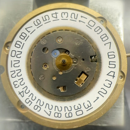 Swiss Made SEMAG 610 quartz watch part with 3 hands and single calendar, precision timepiece component.