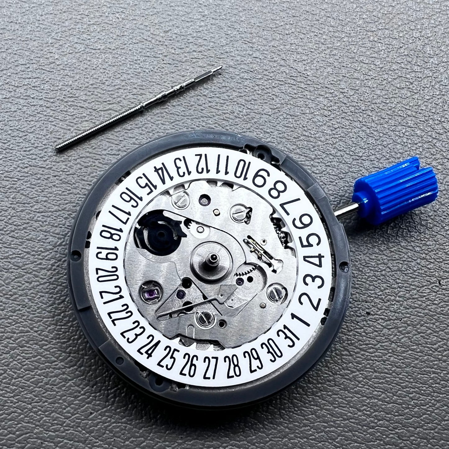 Seiko NH35A watch movement with black dial, 24 jewels, and date display at 6 o'clock for watch repairs.