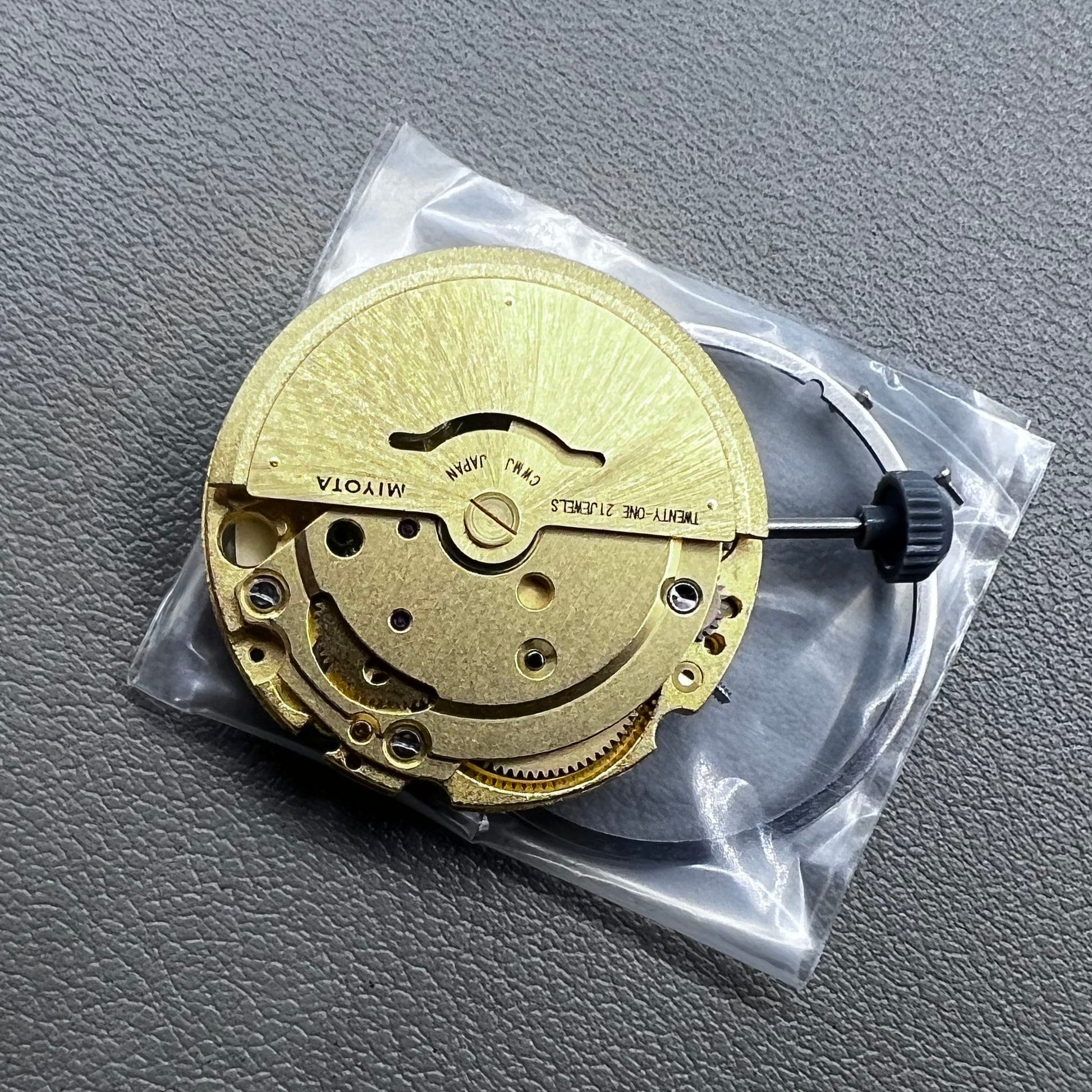 Golden plated Japan Miyota 8205 automatic mechanical watch movement, precision timekeeping component.