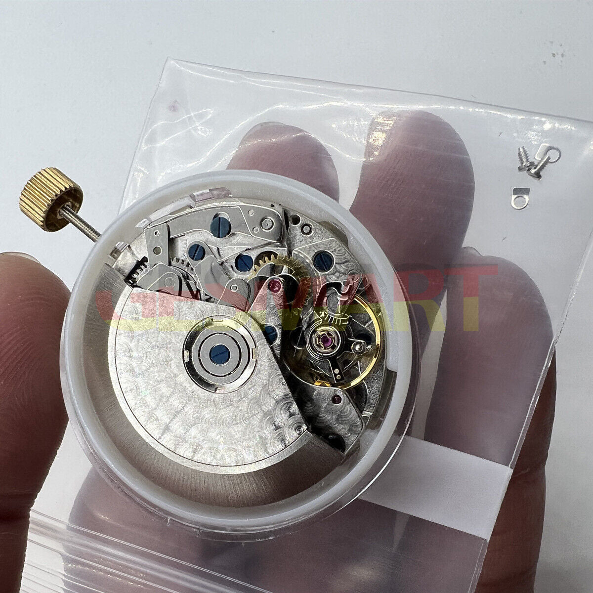 Black Dandong 7753 automatic watch with small second at 9, precise mechanical movement, China made.