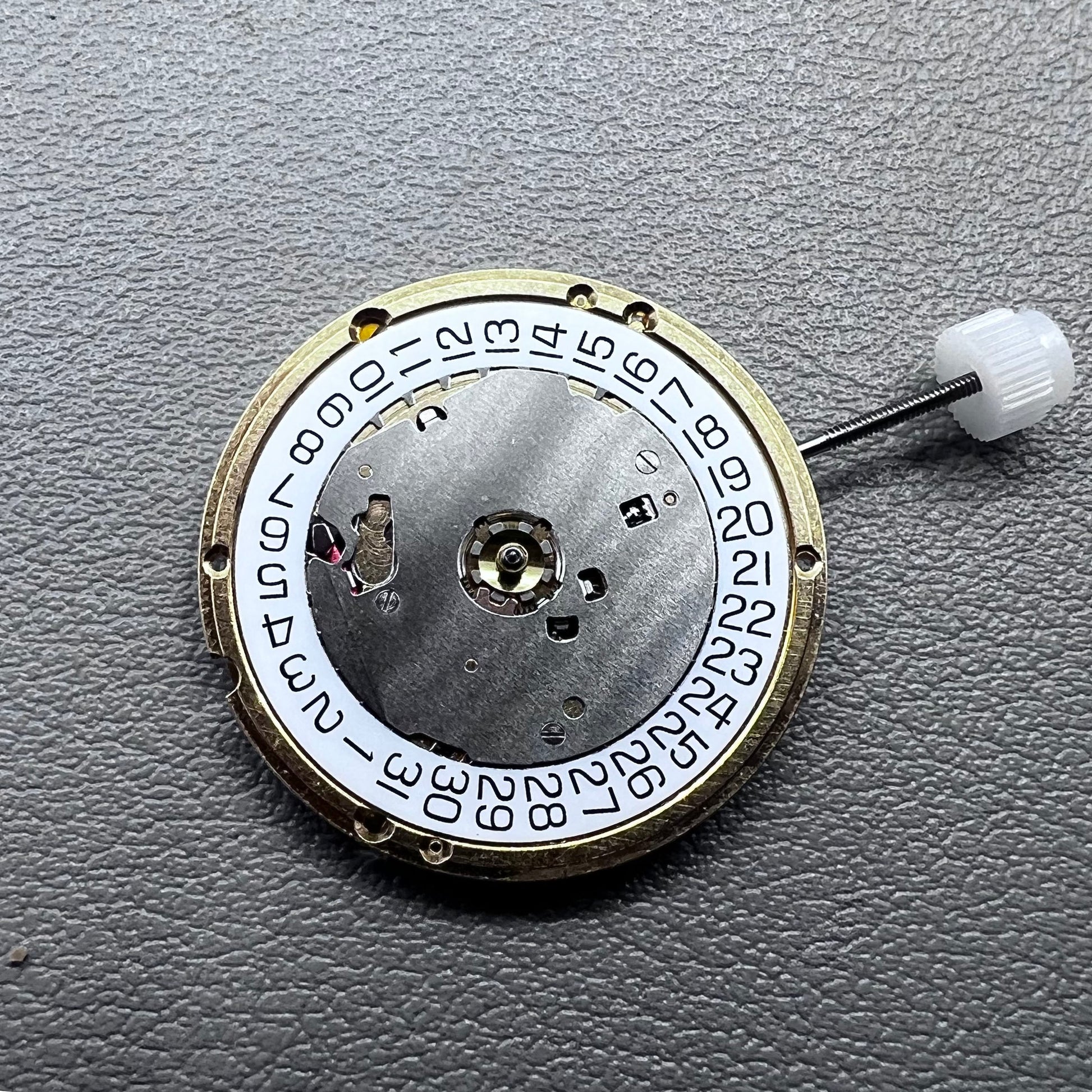 Swiss ETA E63.111 quartz watch movement with 3 hands and date display at 3 o?clock for precise timekeeping.