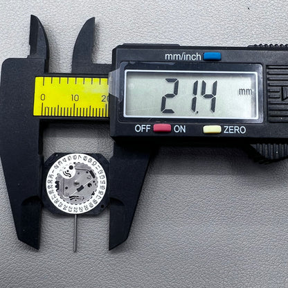 Japan VX22 quartz watch movement with date at 3 o'clock, white disk replacement for precision.