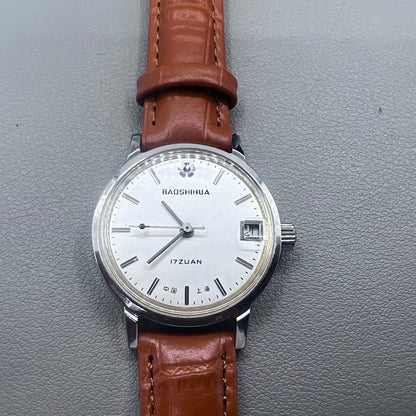 Light brown Shanghai manual mechanical watch with single calendar, 17 jewels, shock-resistant design for durability.