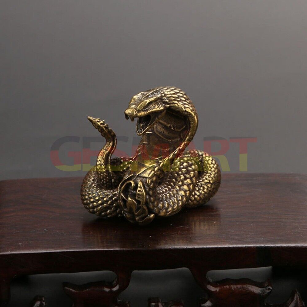 Hand-carved solid copper cobra trinket, detailed vintage snake sculpture accessory.