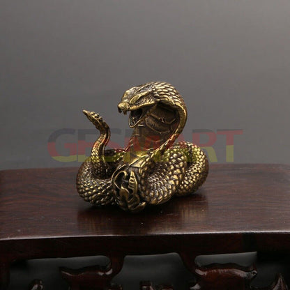 Hand-carved solid copper cobra trinket, detailed vintage snake sculpture accessory.