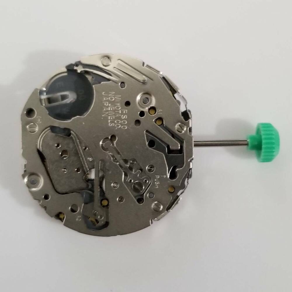 Miyota FS00 quartz watch movement showing detailed components for precise timekeeping.