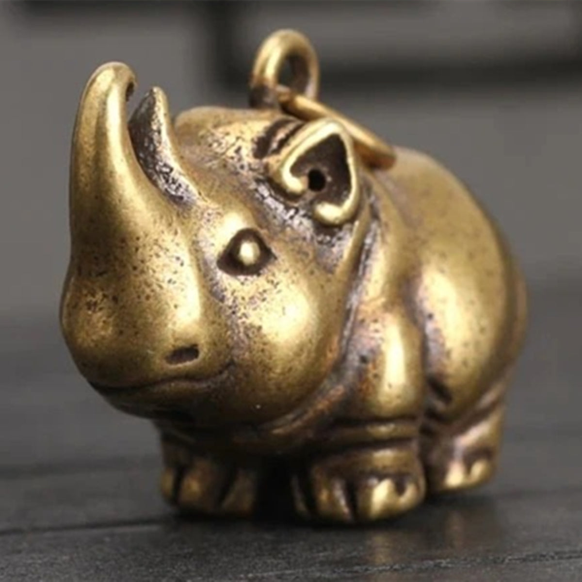 Hand-carved vintage copper rhinoceros figurine, perfect for watch accessory display and d�cor.