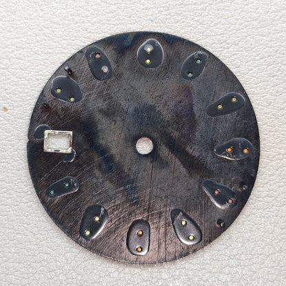 watch dial with S logo