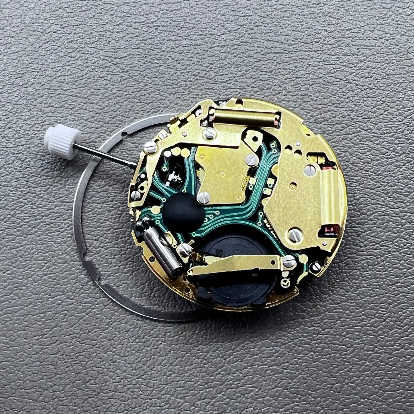 Swiss ISA 8171 golden quartz watch movement with date at 4 o'clock, multi-function design by Swiss ISA.