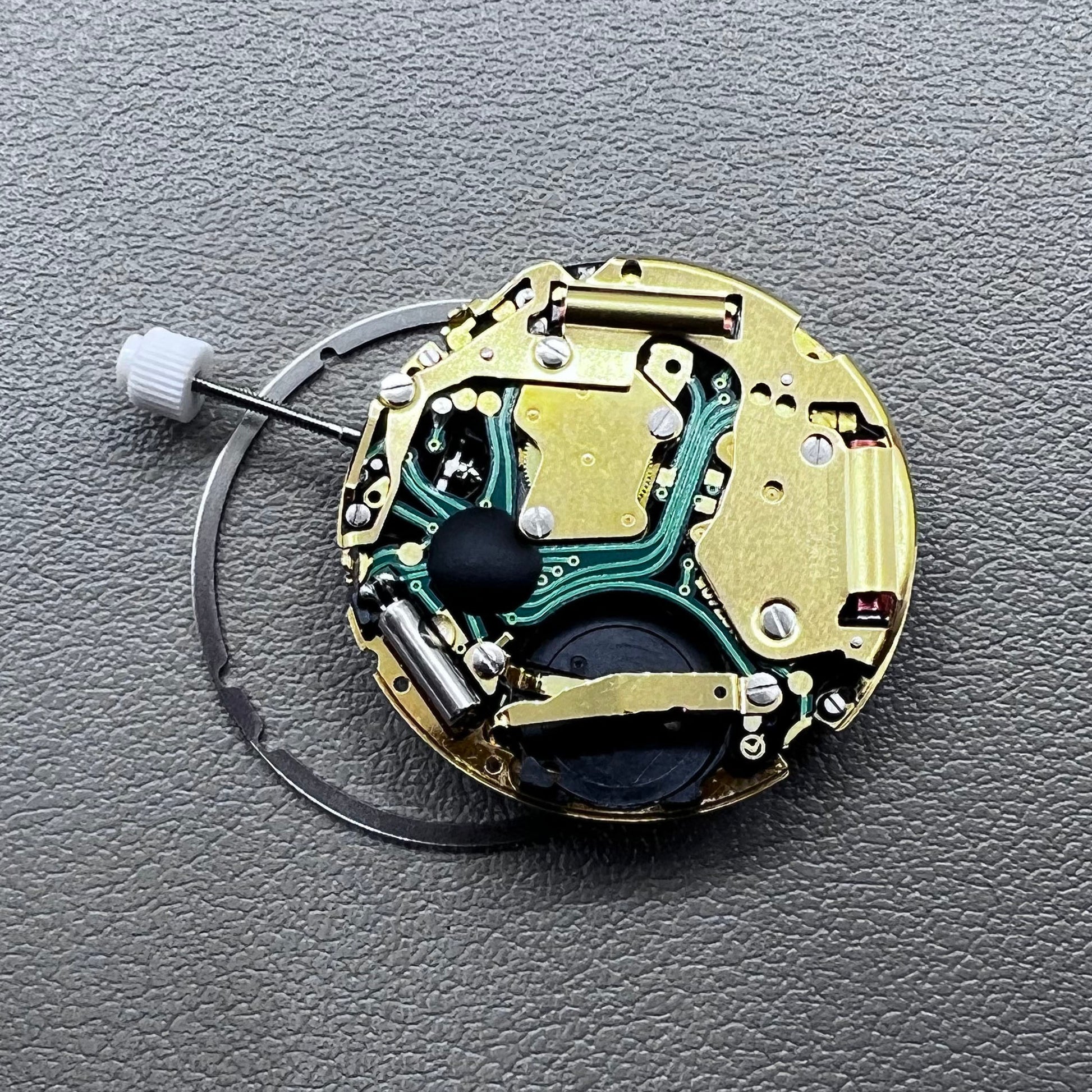 Swiss ISA 8171 golden quartz watch movement with date at 4 o'clock, multi-function design by Swiss ISA.