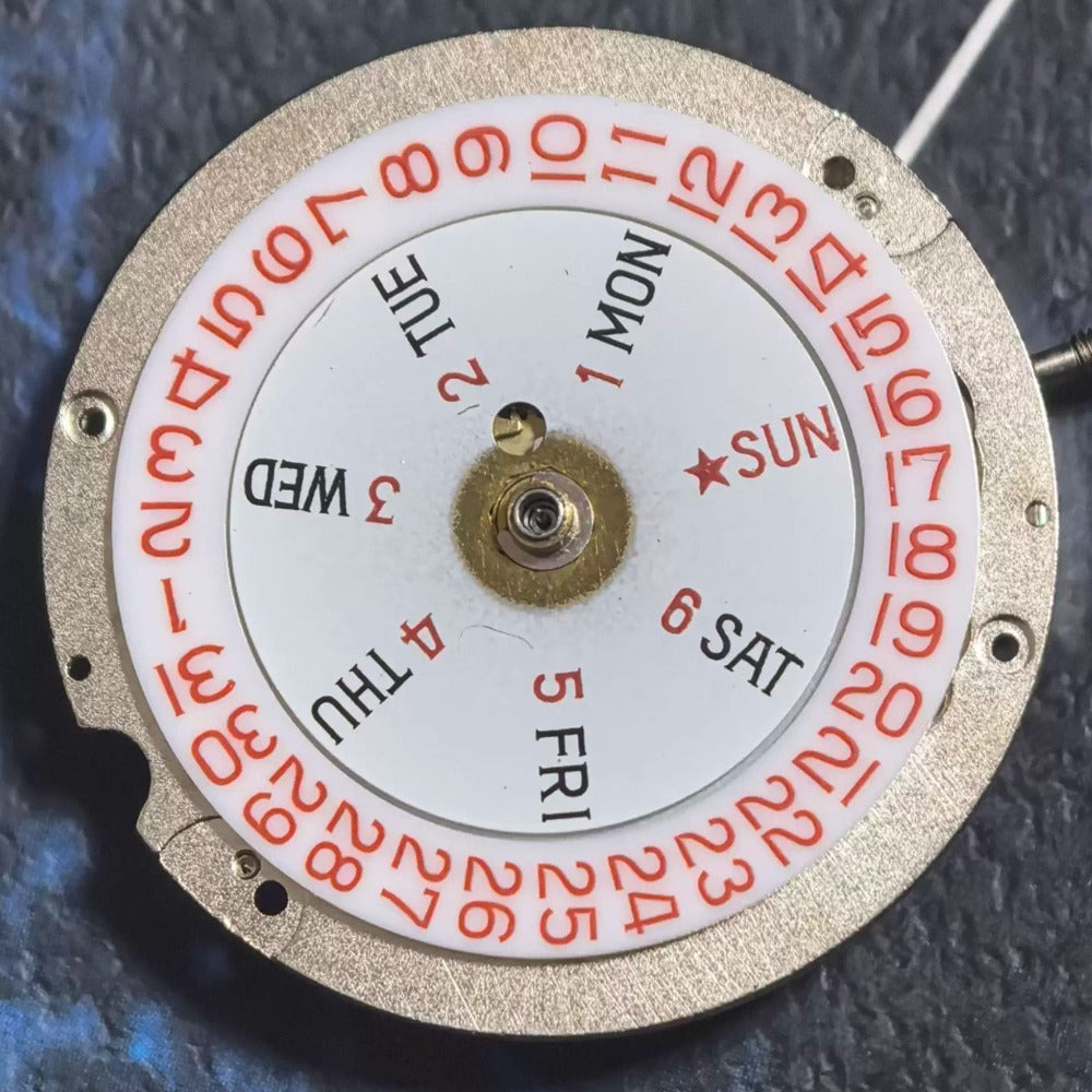 Swiss Made ETA1219 mechanical watch movement with red font, double calendar, and 3 hands for precise timekeeping.
