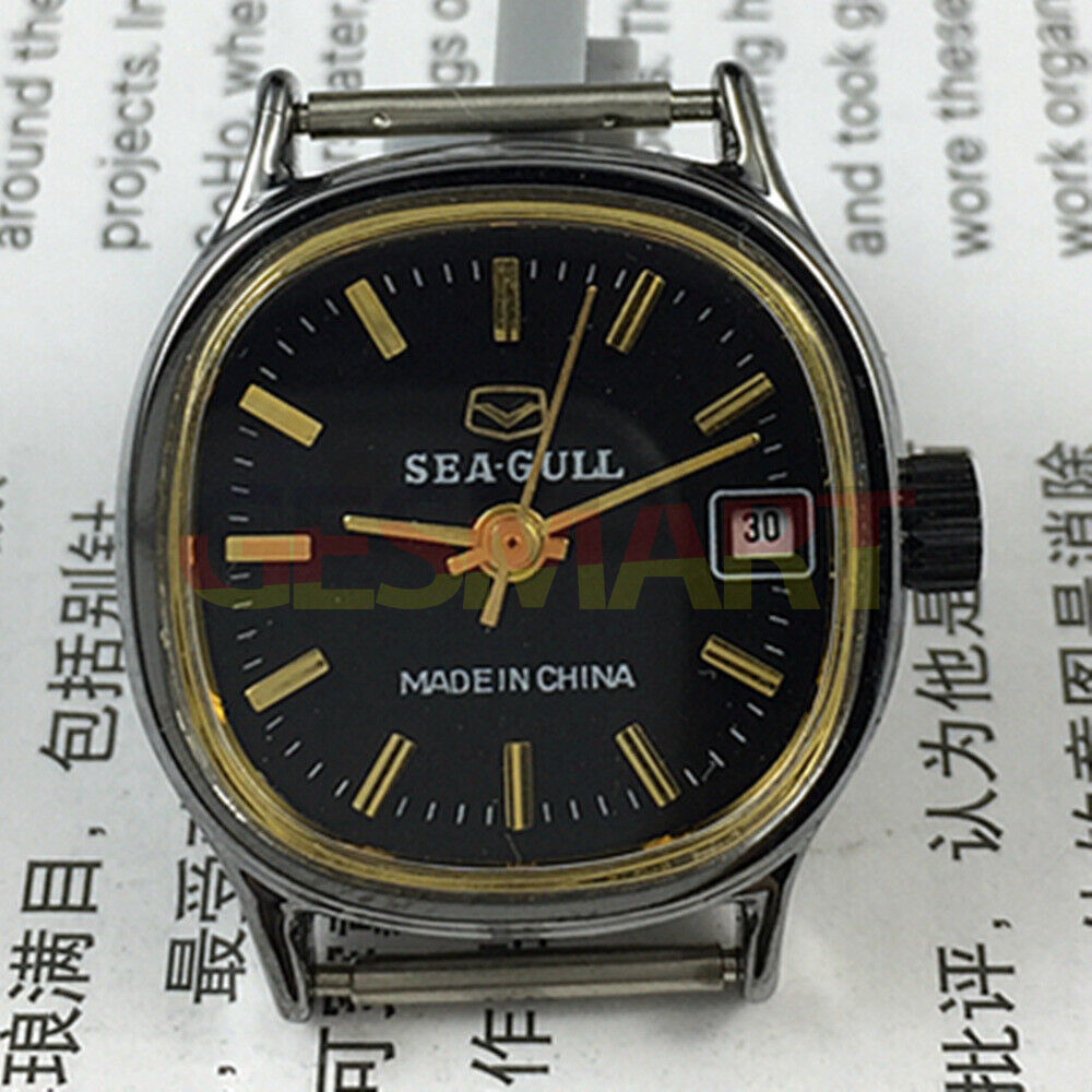 26mm Seagull black case lady watch with golden markers, manual mechanical movement, and calendar display.