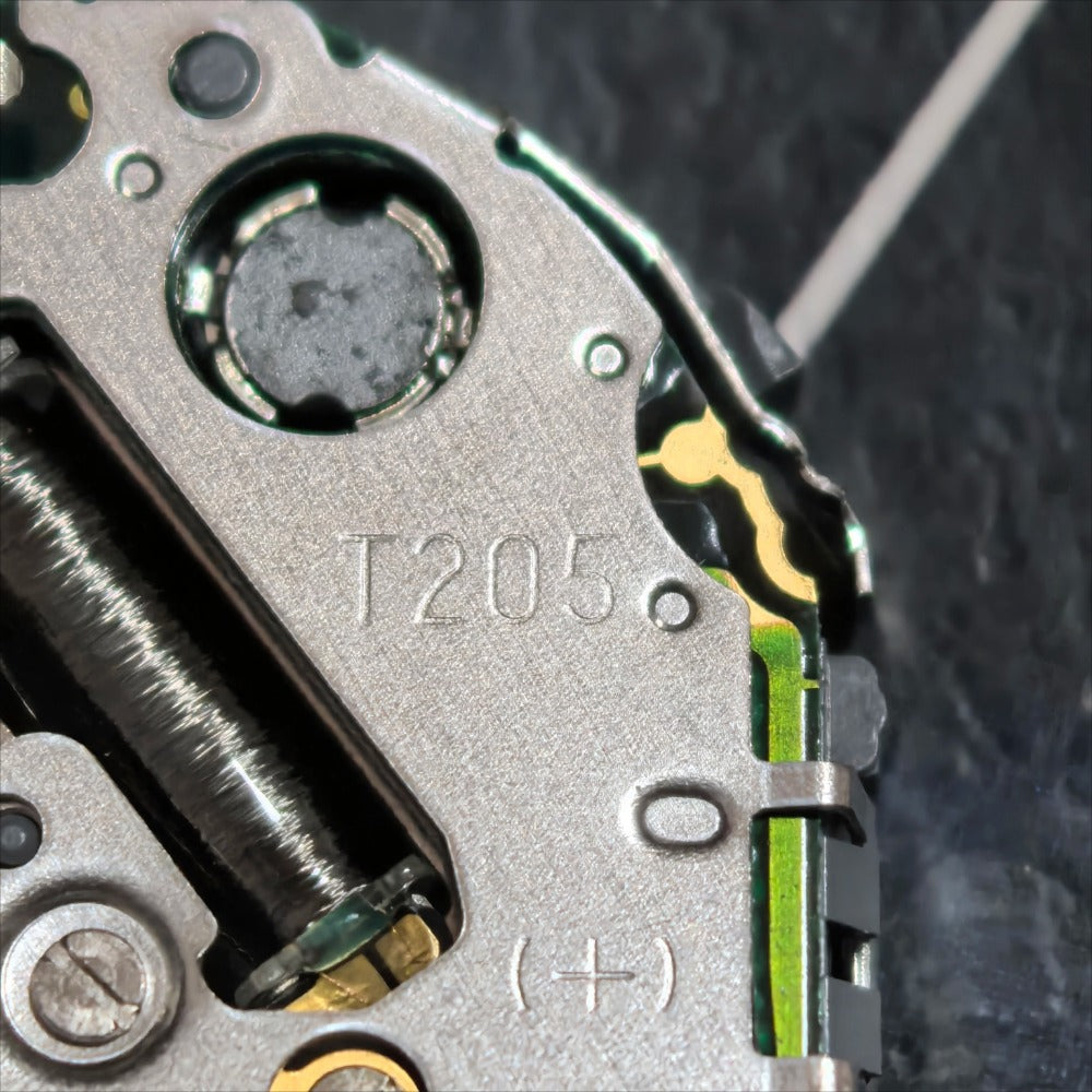 Miyota T205 quartz watch movement with three hands, Japan-made part for precise watch repair and assembly.