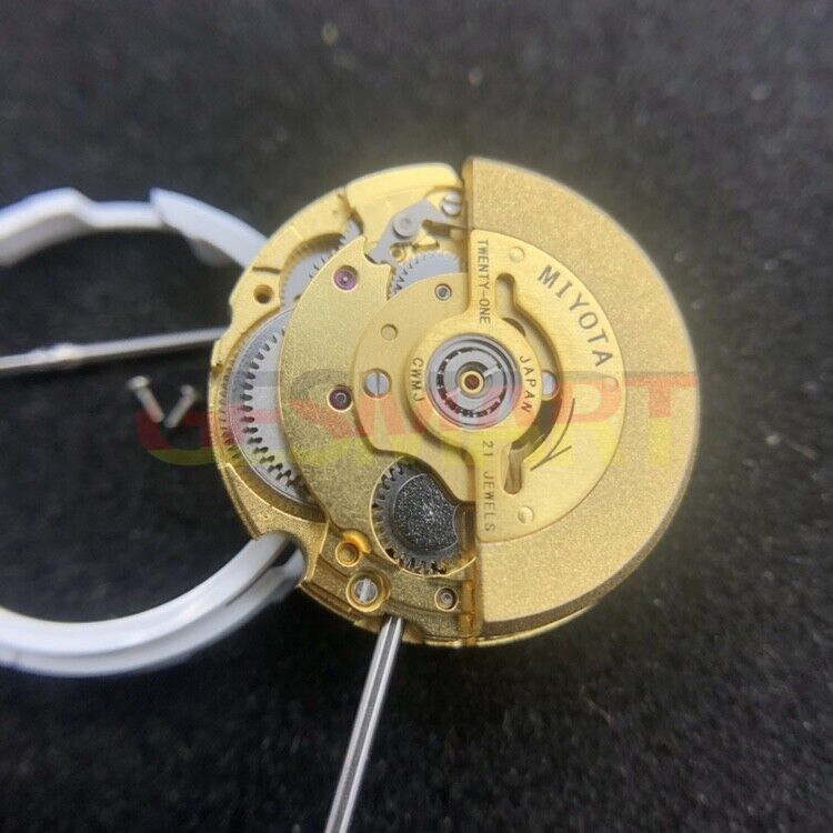 Miyota 6T51 golden plated automatic watch movement showcasing intricate mechanical timekeeping precision.