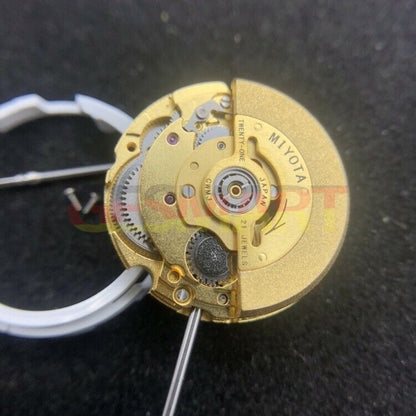 Miyota 6T51 golden plated automatic watch movement showcasing intricate mechanical timekeeping precision.