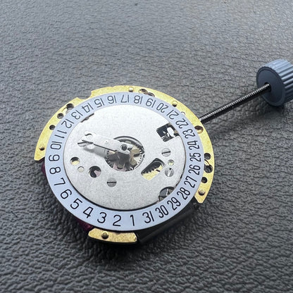 Swiss Ronda 775 quartz watch part with white date disk at 6 o'clock, ideal for precise repairs.