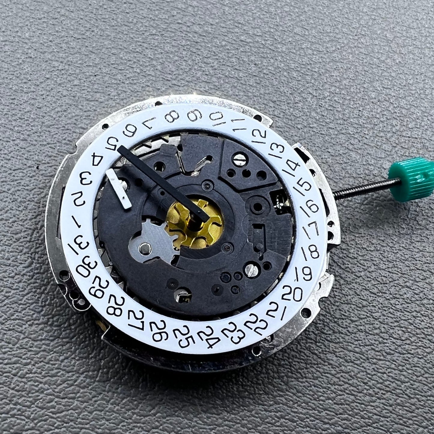 Swiss ISA 8172 silver plated quartz watch movement with stem, precise timekeeping for watch repair and assembly.