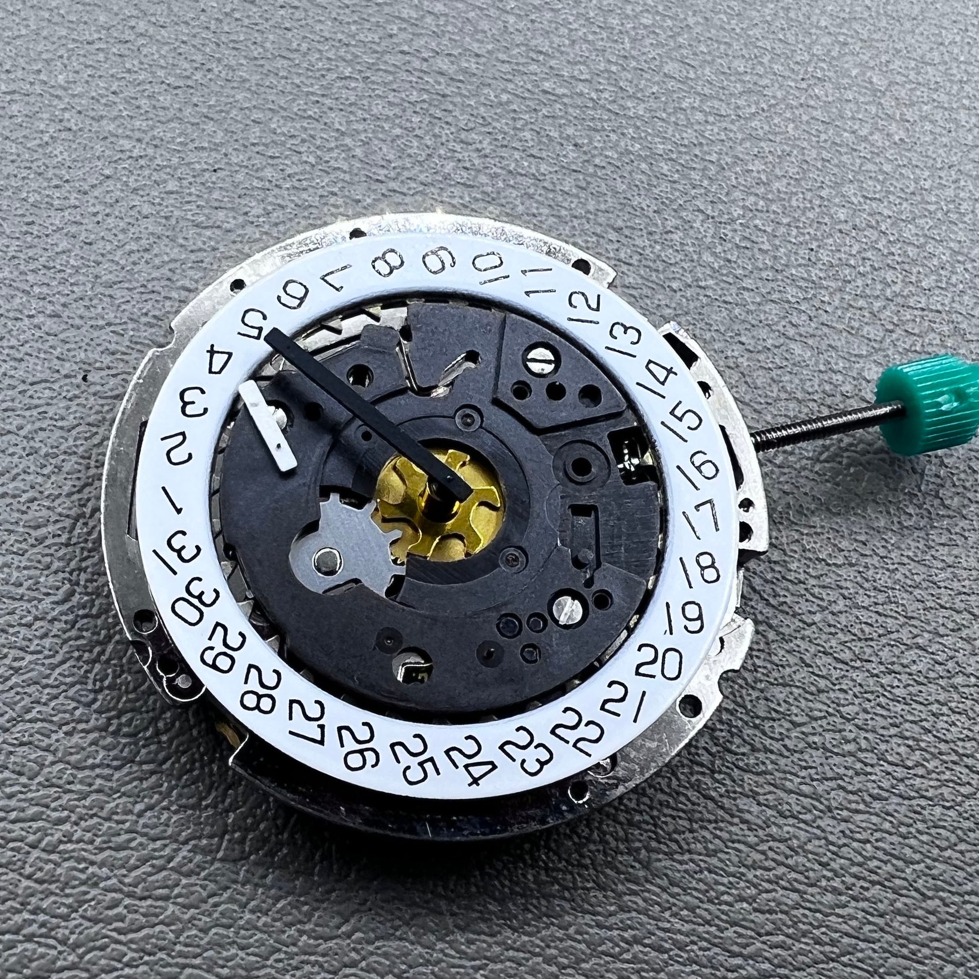 Swiss ISA 8172 silver plated quartz watch movement with stem, precise timekeeping for watch repair and assembly.