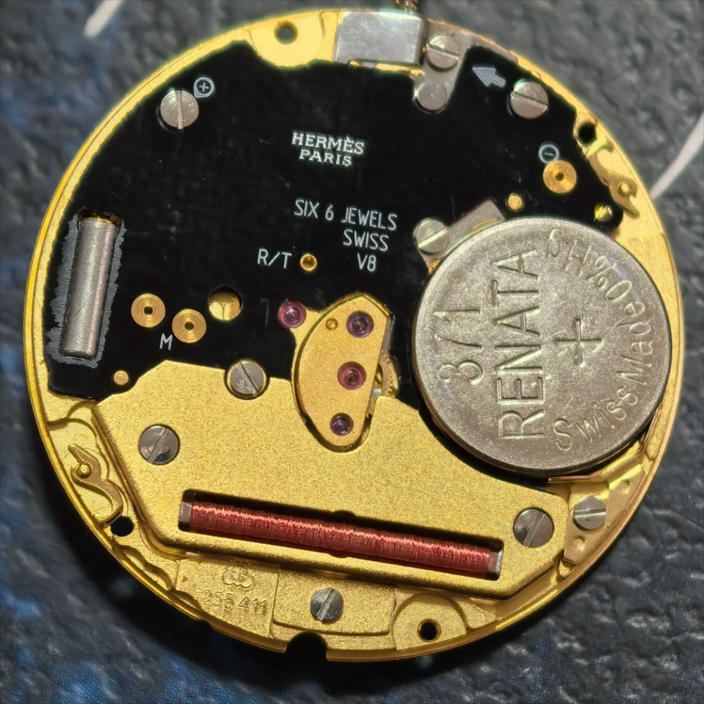 Swiss Made ETA255.411 quartz movement watch part with white dial, 3-hand design for precise timekeeping.