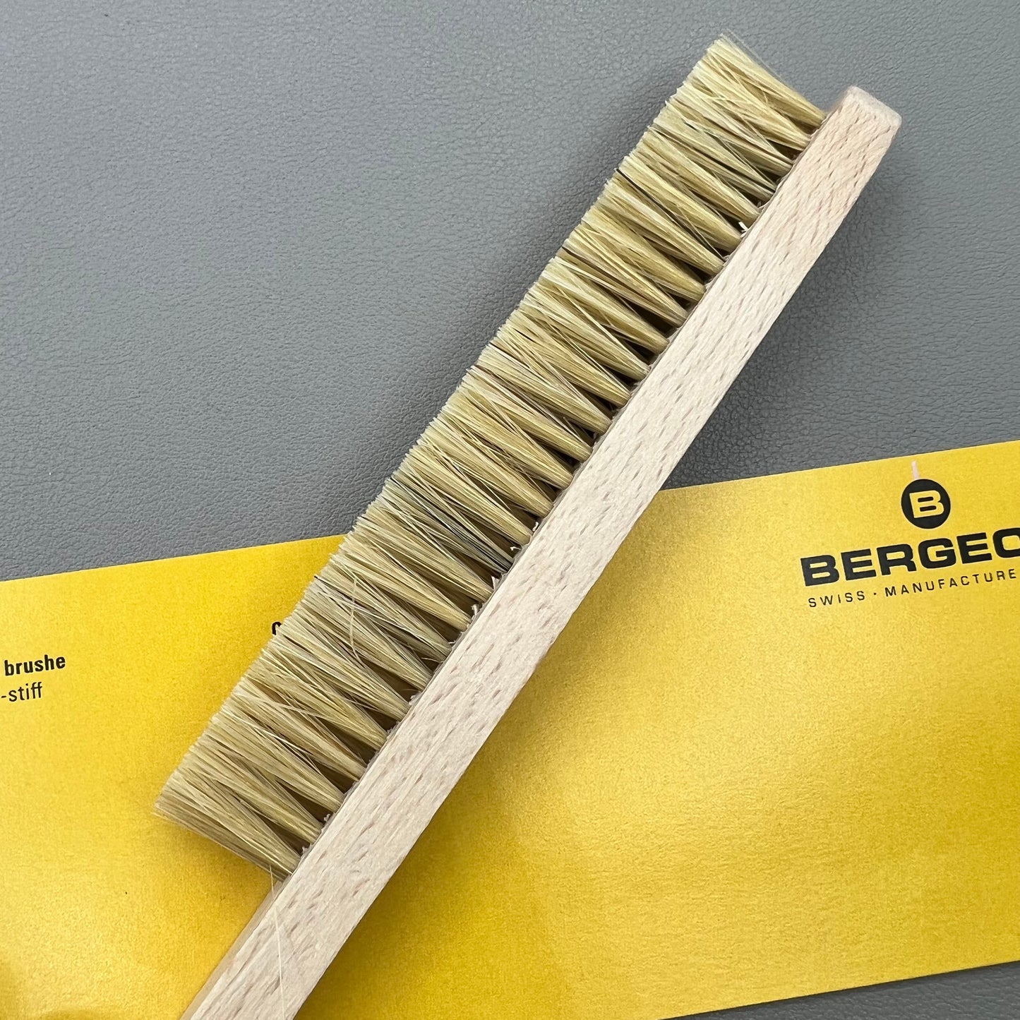 Swiss Bergeon 6377-2 hand brush with hard bristles for precise watch accessory cleaning.