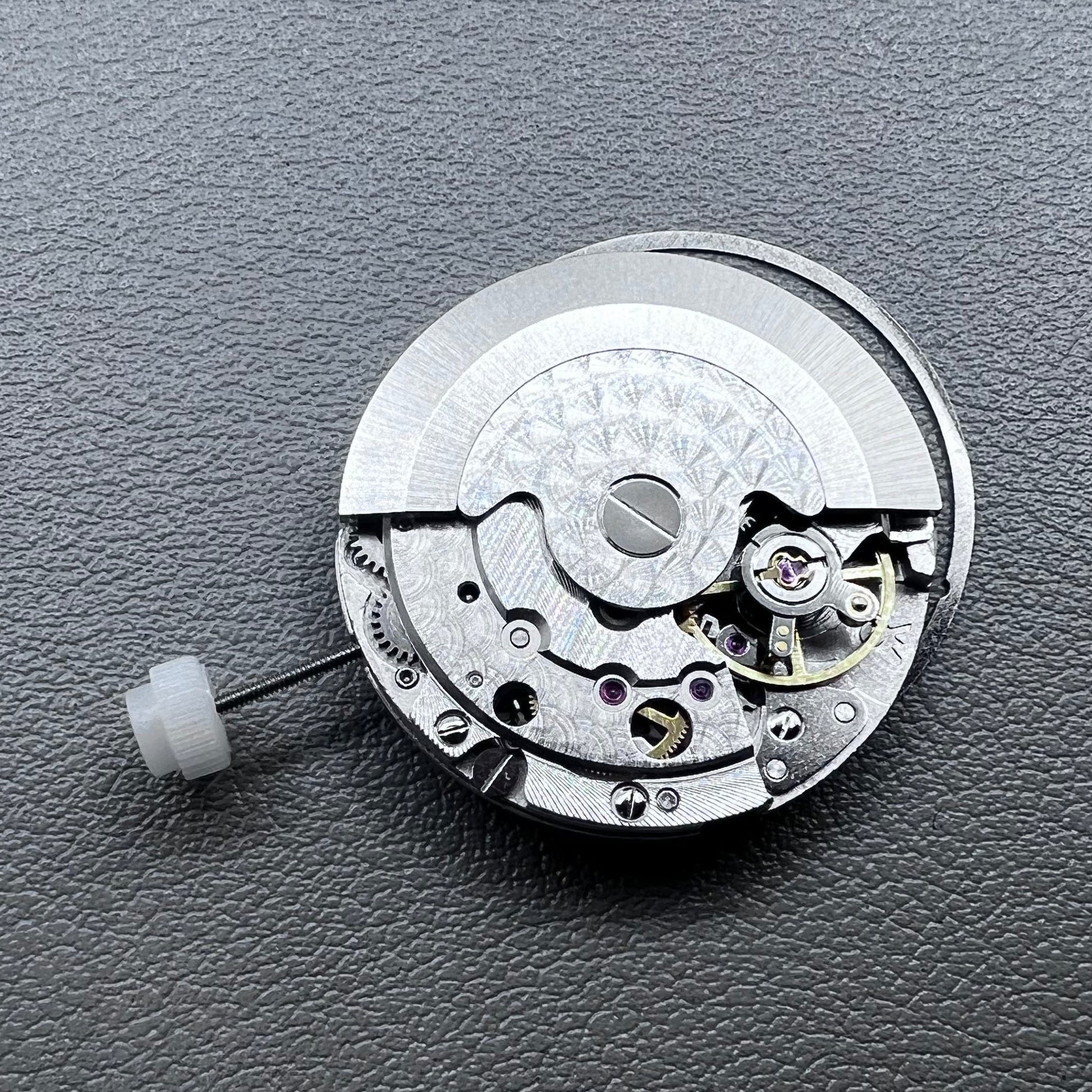 Silver plated DG2813 automatic watch movement with large and small hands, date display at 3 o'clock