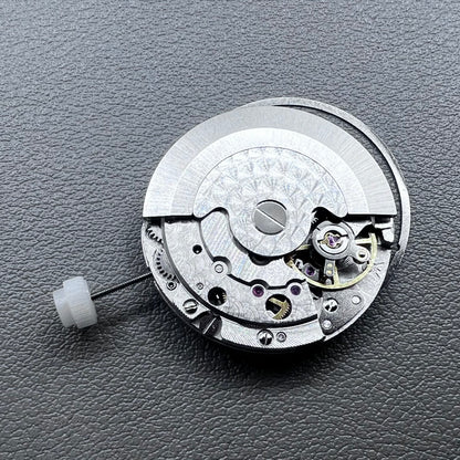 Silver plated DG2813 automatic watch movement with large and small hands, date display at 3 o'clock