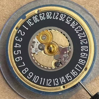 Swiss Made ETA955.412 quartz watch part with black disk date at 6, precise 3-hand movement by ETA