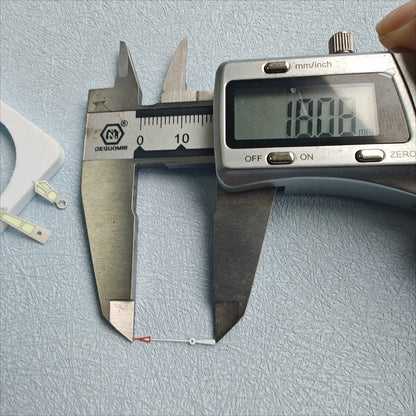 18mm C3 green lume silver-trim watch hands for NH34-72, boosting visibility and style by BrandName.