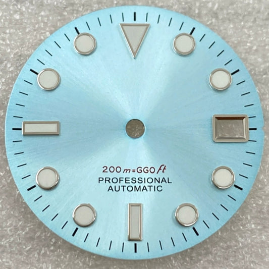 Green lume nail watch dial with silver trim on light blue background, compatible with NH35/36 movement.