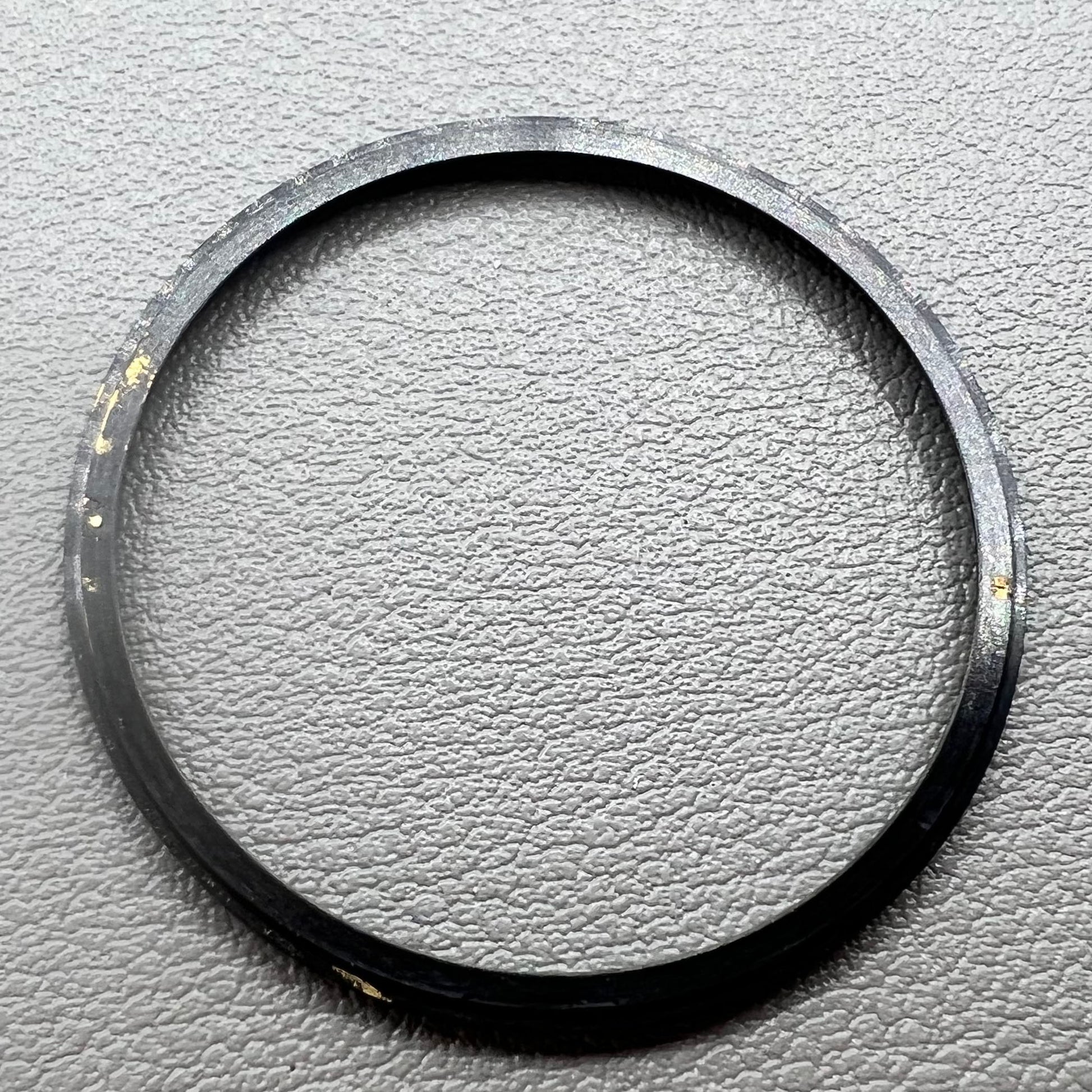 Black stainless steel chapter ring 34.9mm x 31.0mm x 1.9mm for watch accessory.